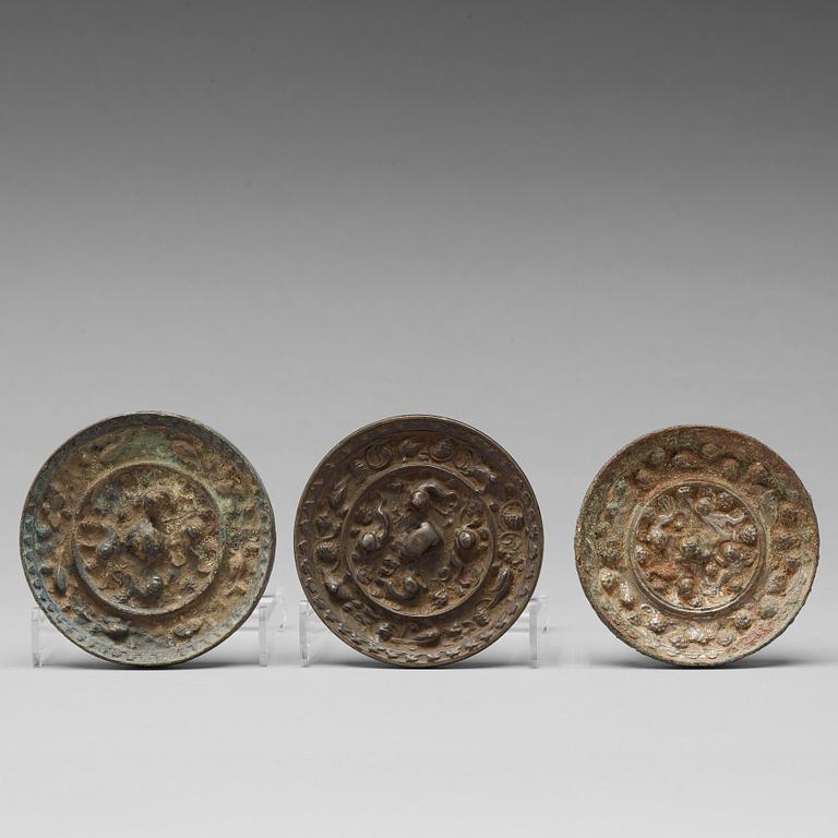 Three Mythical Beast bronze mirrors, Han dynasty (206 BC.-220 AD.).