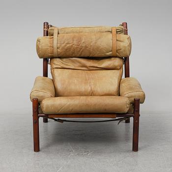 AN ARNE NORELL "INCA" LOUNGE CHAIR.
