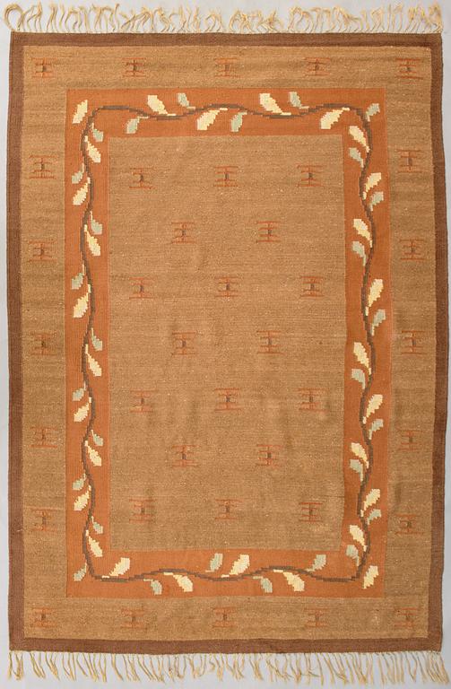 A 1920s Finnish flat weave carpet probably for Kotiteollisuus Oy Orkamo. Circa 340x245 cm.