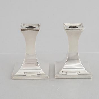 A pair of silver candlesticks, mark of William Hutton & Sons Ltd, Sheffield 1911-1912.