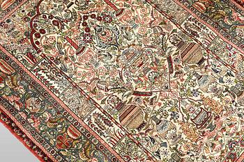 An oriental silk rug, c. 109 x 76 cm.