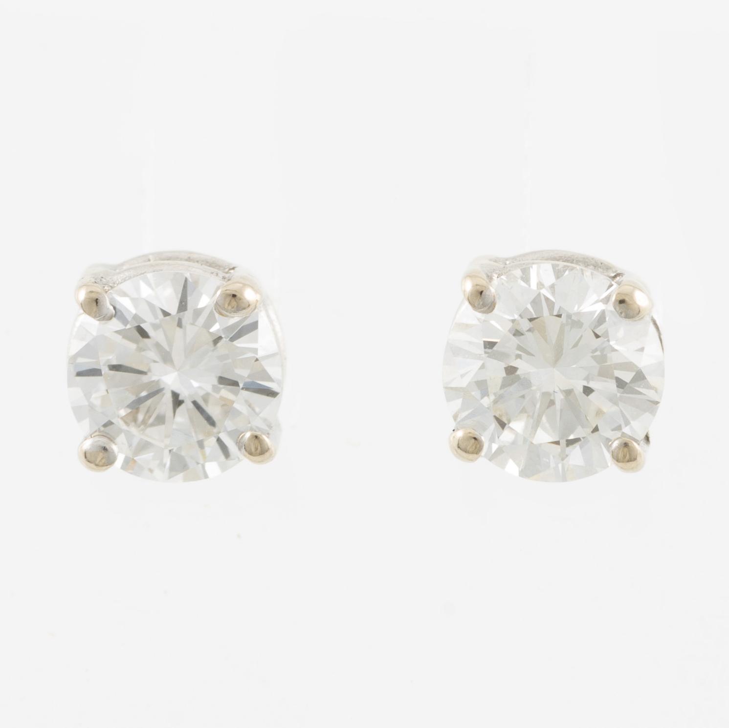 Earrings, a pair, 14K white gold and brilliant-cut diamonds.