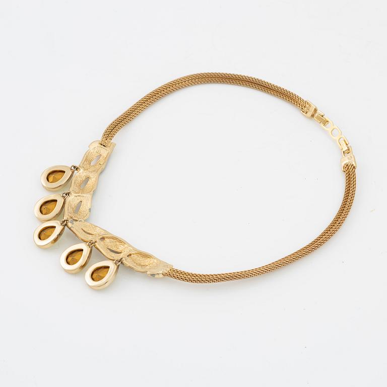 Christian Dior, a costume jewellery necklace and two pairs of earrings.