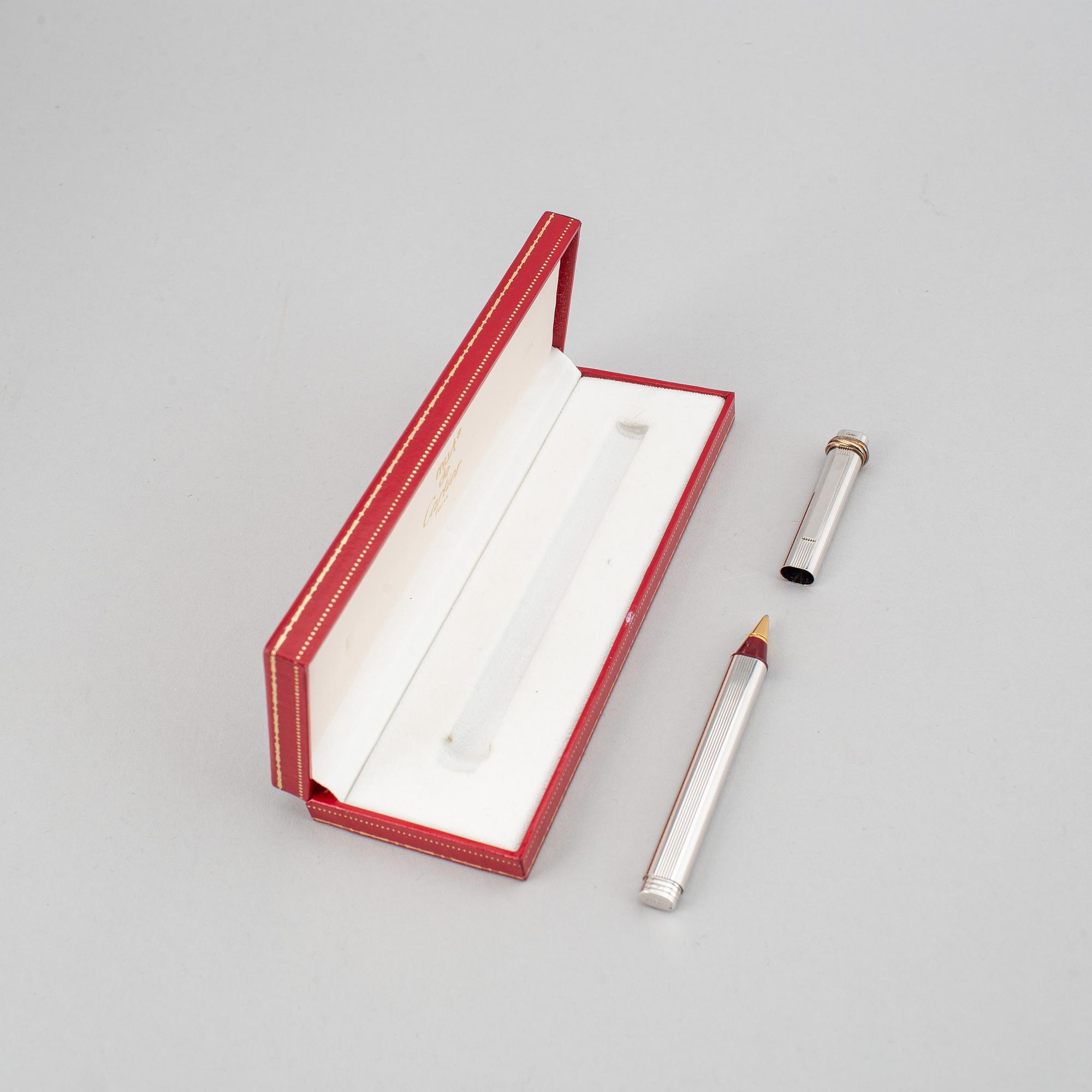 A Cartier lighter and pen.
