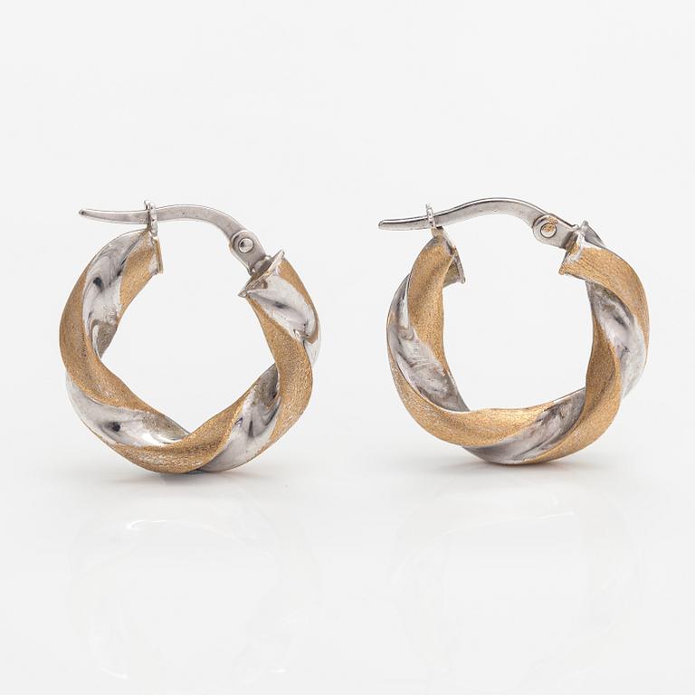 A pair of 14K white and yellow gold earrings. Unoaerre, Italy.