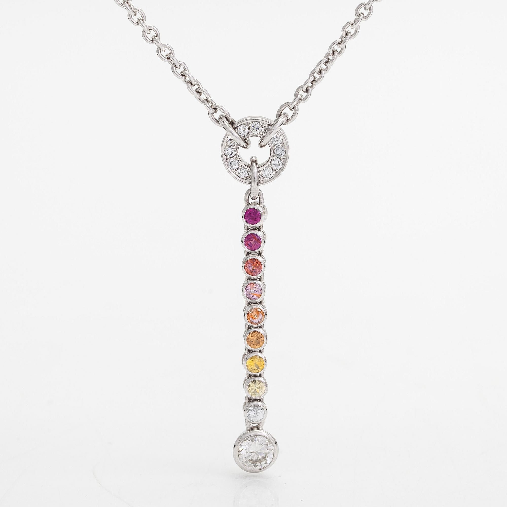 An 18K whitegold necklace with a diamond ca 1.01 ct, smaller diamonds tot. ca 0.15 ct, ruby and 
sapphires, Helsinki.