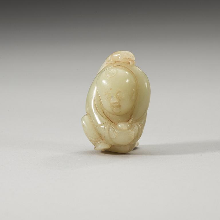 A Chinese nephrite figure of a boy.