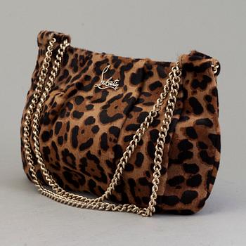 A leopard patterned ponyhair handbag by Christian Louboutin.