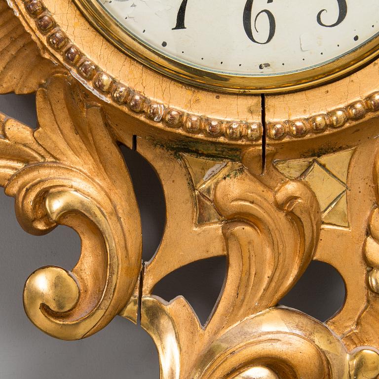 A Rococo style wall clock from first half of the 20th century.