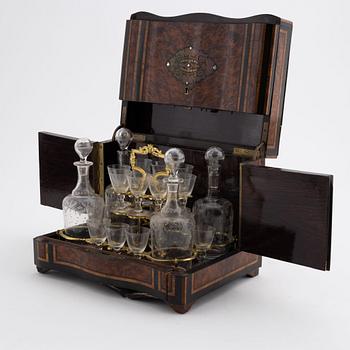 A French burr-walnut veneered tantalus, late 19th Century.