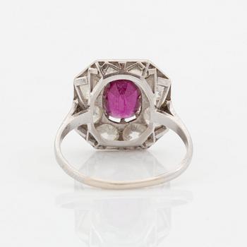 An 18K white gold ring set with a ruby and old-cut diamonds.