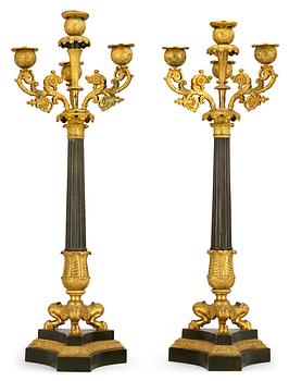603. A pair of French Empire early 19th century four-light candelabra.