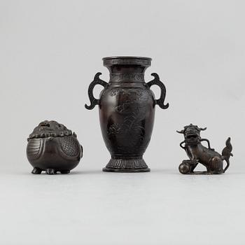 A Chinese bronze vase, figurine and censer, late Qing dynasty.