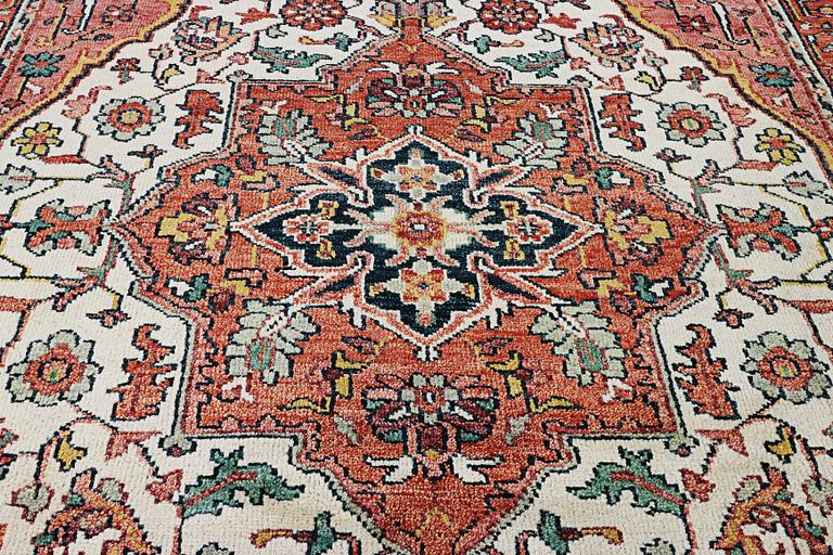 An oriental carpet with Mamluk design, c. 367 x 280 cm.