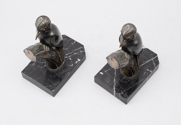 BOKSTÖD, 1 par, patinerad metall, signerade Franjuo, 1900-talets första hälft.