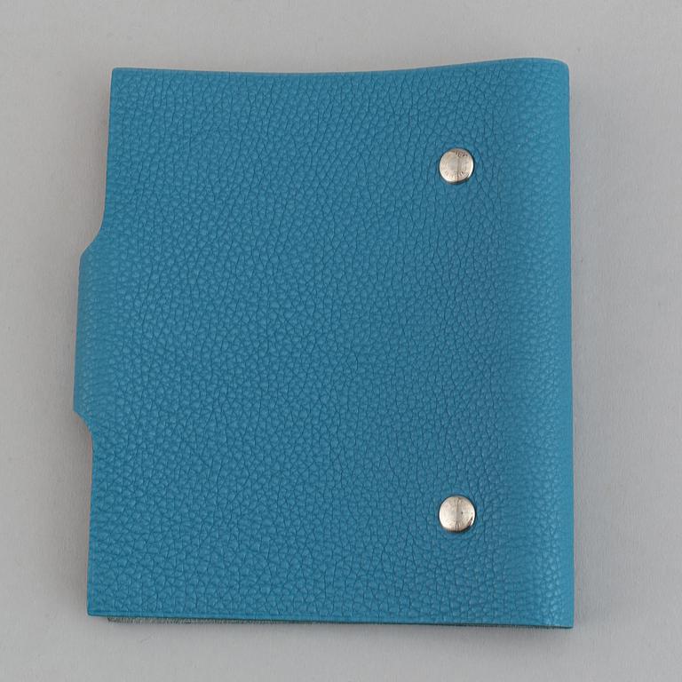 Hermès, a blue leather notebook with two scripple pads.