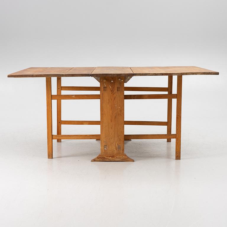 A drop-leaf table, 19th Century.