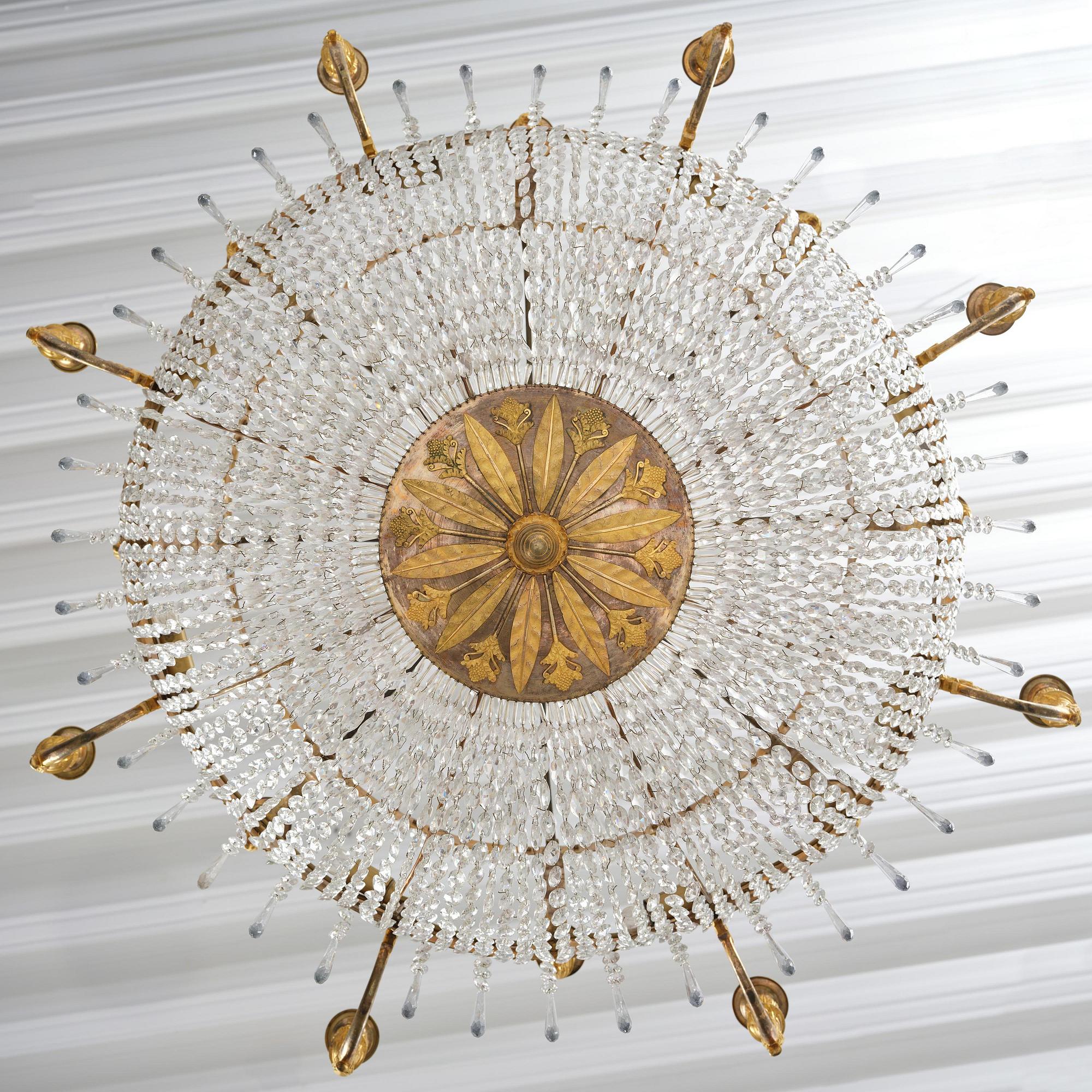 An ormolu and cut glass sixteen-branch Empire chandelier, Paris, early 19th century.