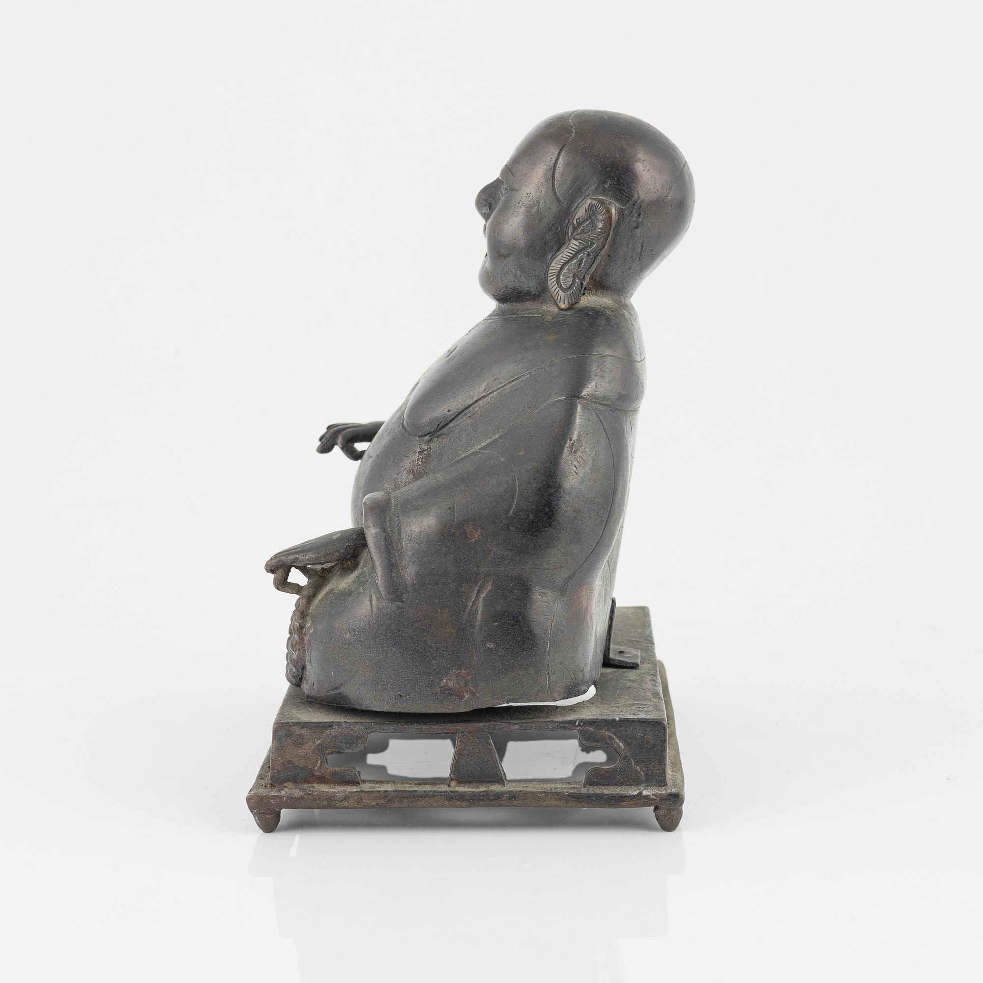A bronze figure of Buddai, Qing dynasty (1664-1912).