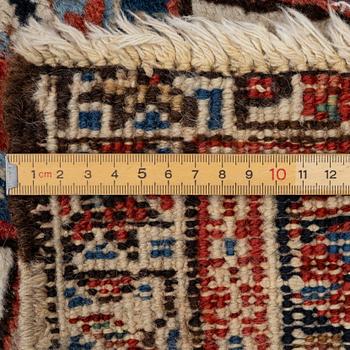 An antique Heriz carpet, west Persia, c. 333 x 238 cm.