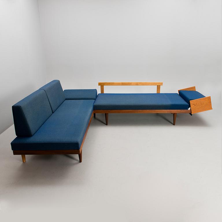 A corner sofa, mid 20th century.