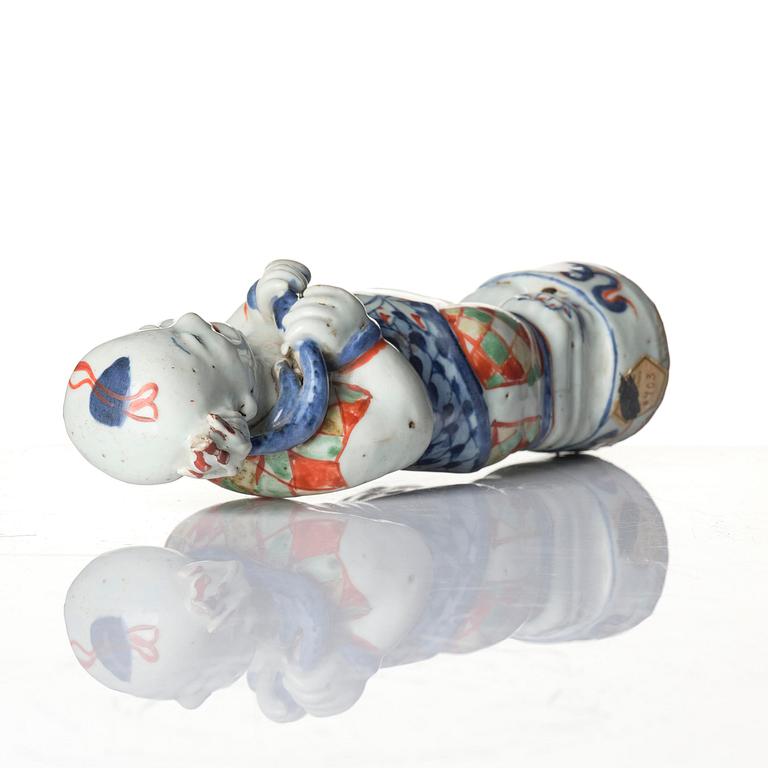 Three Chinese famille verte figures of laughing boys 'Hehe Erxian', 18th century.