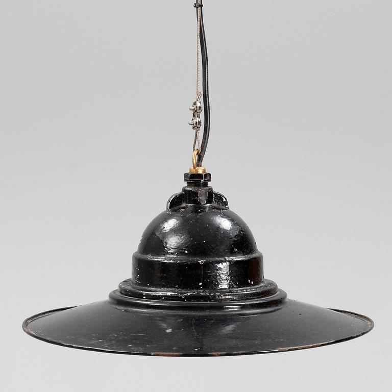 An early 20th century industrial lamp.