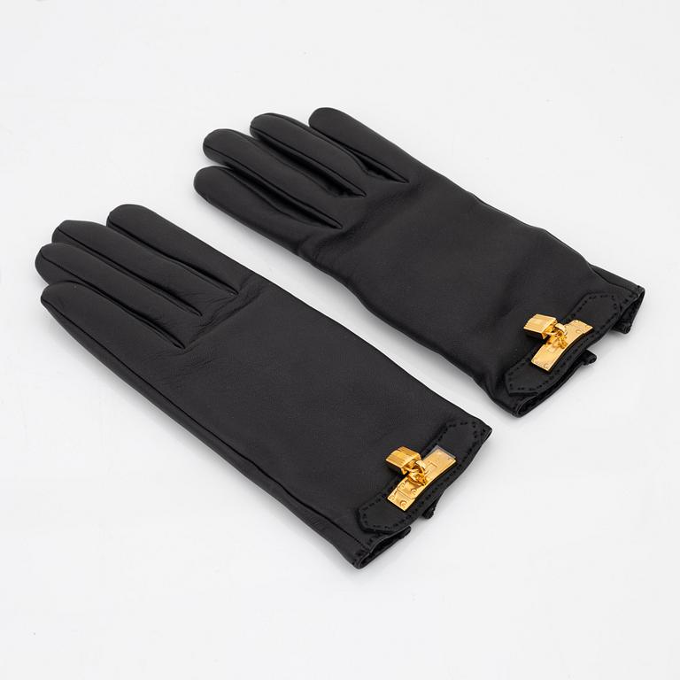 Hermès, a pair of black 'Kelly' kidskin and lambskin gloves, french size 7.