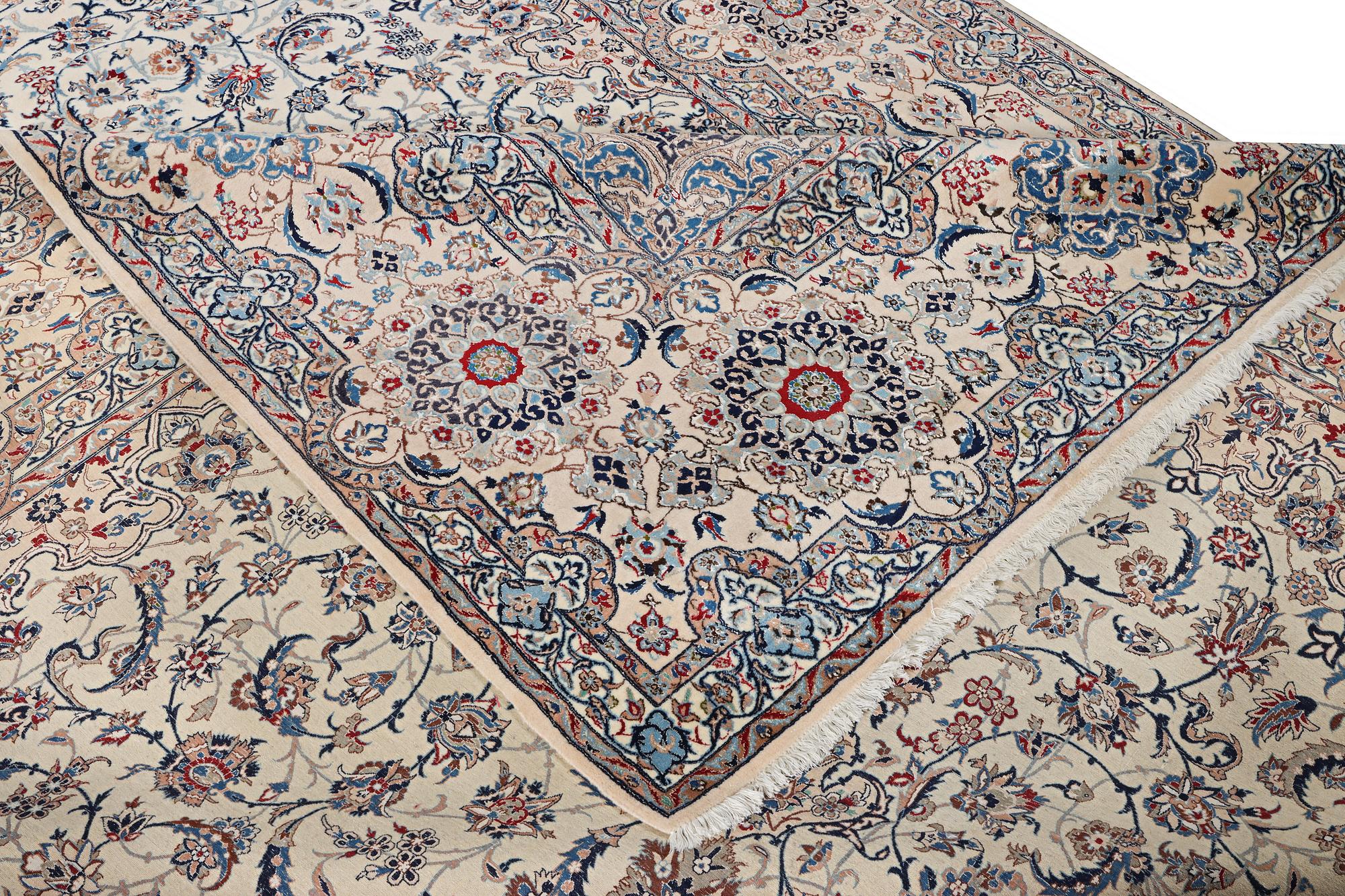 A Nain carpet, part silk, 9 laa, c. 453 x 298 cm.