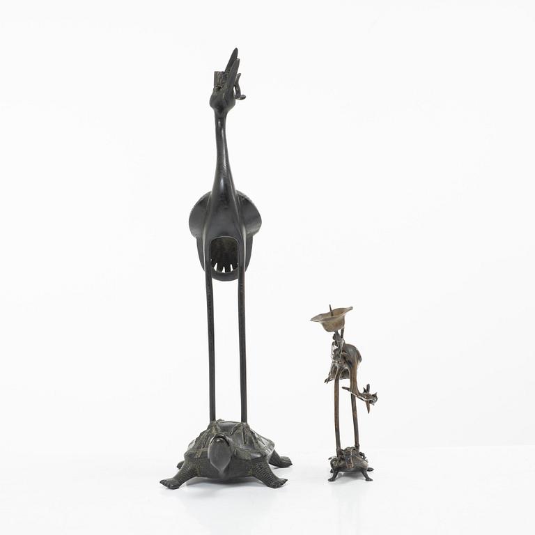 Two bronze sculptures/candle holders, Japan & China, 20th century.