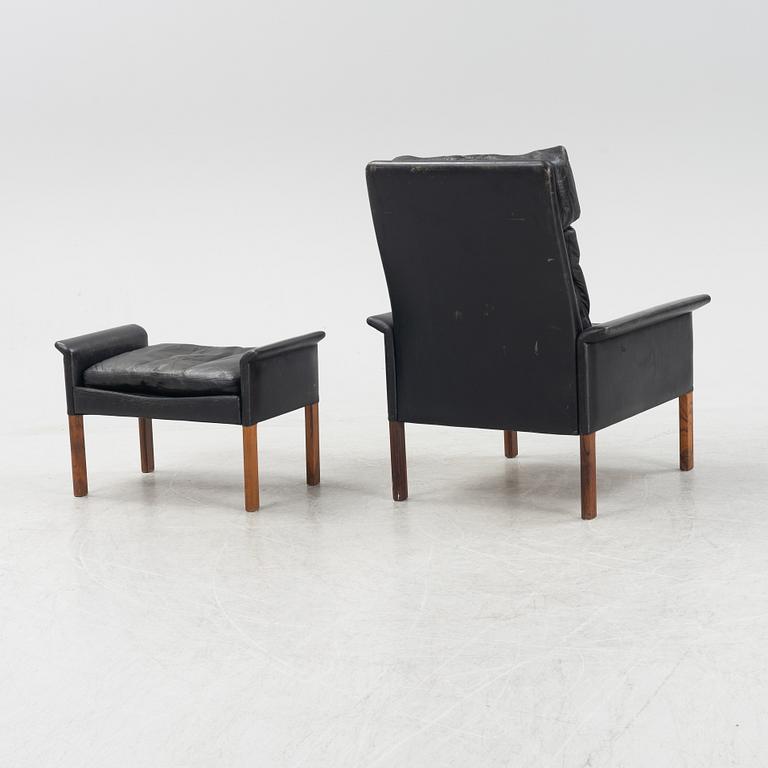 Hans Olsen,  a black leather easy chair with a stool, CS Möbler, Denmark, 1950's-60's.