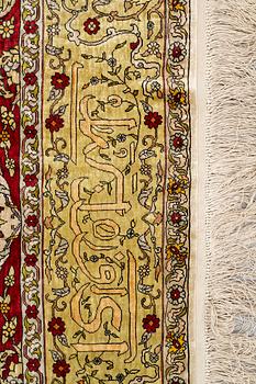 A rug, Old silk Hereke, ca 178 x 119 cm.