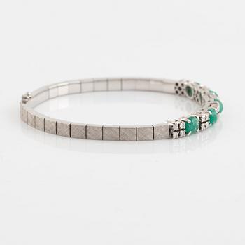 Bracelet, white gold with cabochon-cut emeralds and brilliant-cut diamonds.