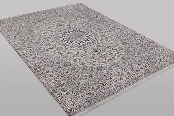 A carpet, Nain, part silk, ca 341 x 245 cm.