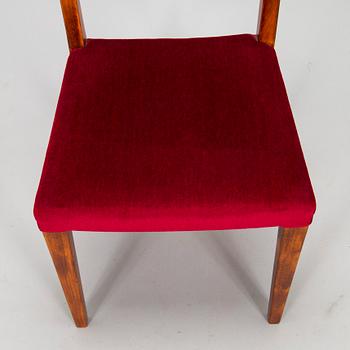 A mid 20th century dining table and a set of four chairs, Oy Boman Ab and two chairs Werner West.