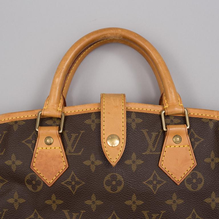 "Housse Porte-habits"  Louis Vuitton.