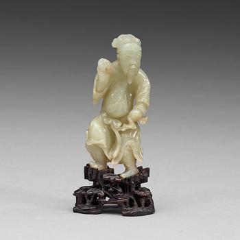 36. A nephrite sculpture of a man, Qing dynasty (1644-1912).