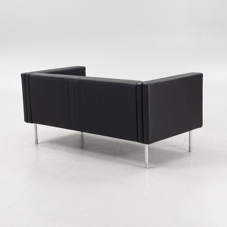 A leather upholstered sofa, 21st Century.