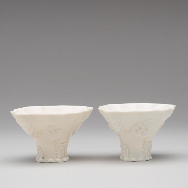 Two blanc de chine rhinoserous shaped libation cups, Qing dynasty, Kangxi (1662-1722).