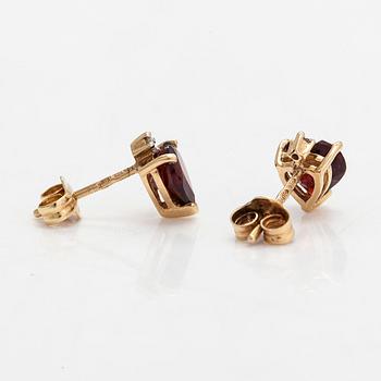 A pair of 14K gold earrings with garnets and diamonds ca 0.002ct in total.