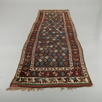 A Persian semiantique runner, ca 369 x 117 cm.