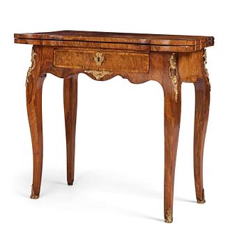 35. A Swedish walnut-veneered and gilt-brass mounted rococo games table, later part of the 18th century.