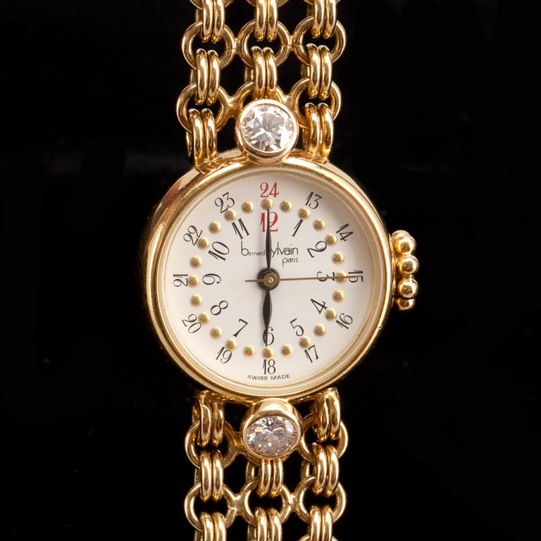 ARMBANDSUR, 18K guld med briljantslipade diamanter ca 0,60ct, Bernard Sylvain, Paris. Vikt ca 56g.