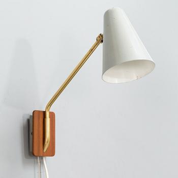 A mid-20th century wall light for Valinte.