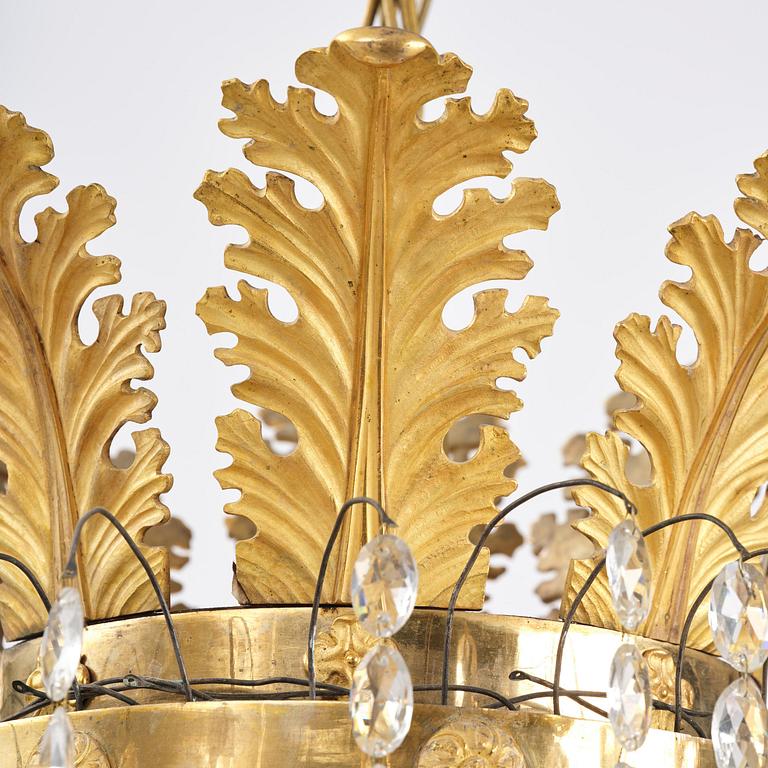 An ormolu and cut glass sixteen-branch Empire chandelier, Paris, early 19th century.
