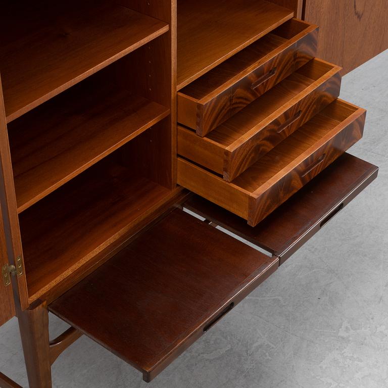 A beech and mahogany mid 20th century cabinet.