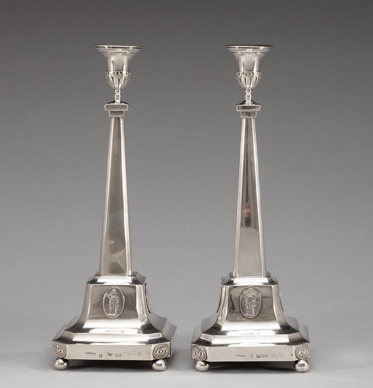 A pair of 18th century silver candelabra and a pair of candlesticks, makers mark of Pehr Zethelius, Stockholm 1796.