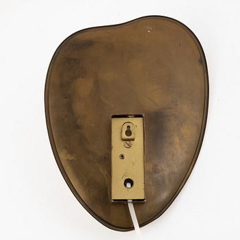 A Swedish Modern brass wall sconce, 1950's.