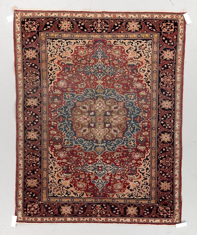 A CARPET, a semi-antique Esfahan, ca 174,5 x 143,5 cm.