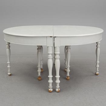 A mid 19th century dining table with six extension leaves.